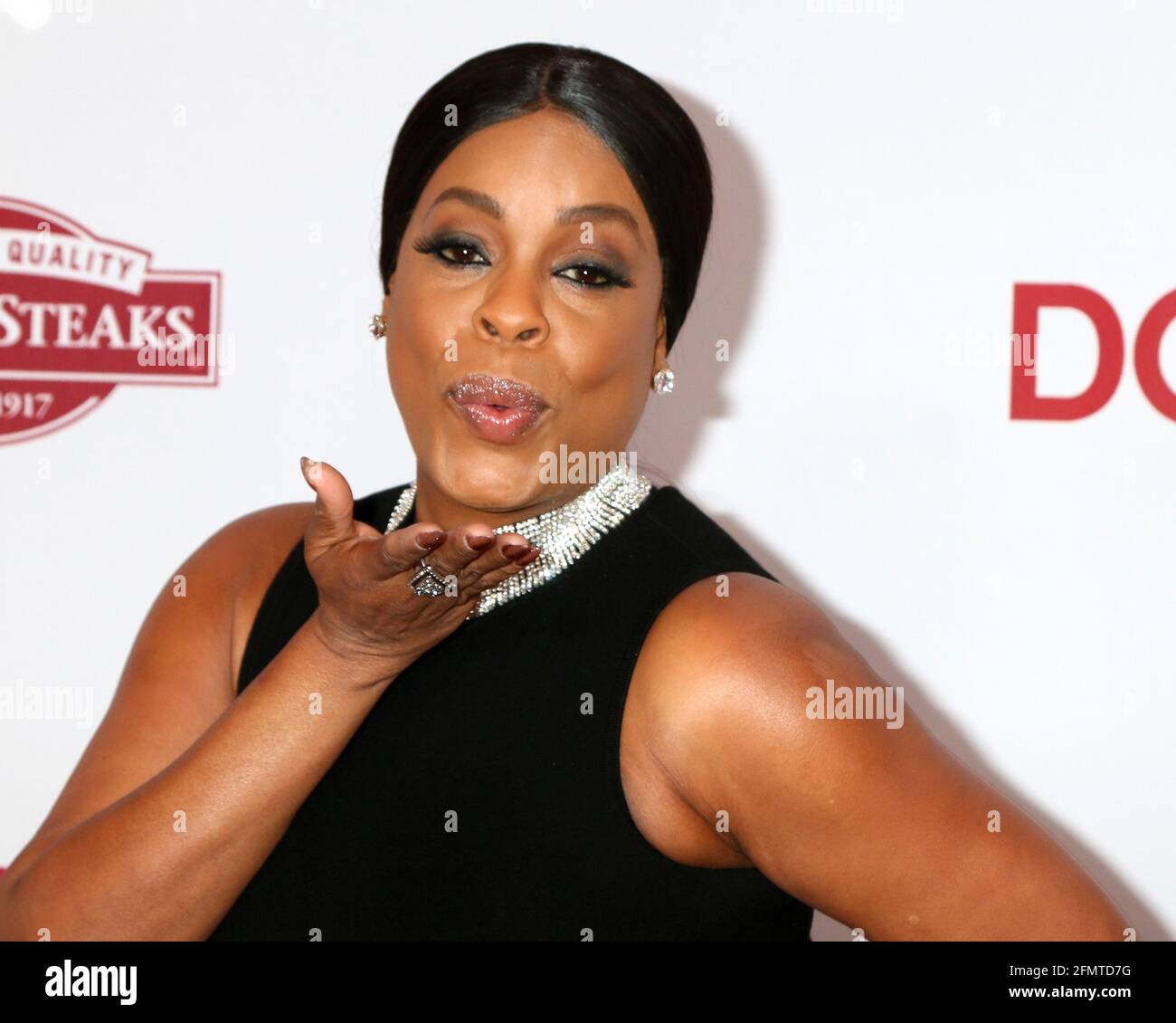 LOS ANGELES - DEC 18:  Niecy Nash at the 'Downsizing' Special Screening at Village Theater on December 18, 2017 in Westwood, CA Stock Photo