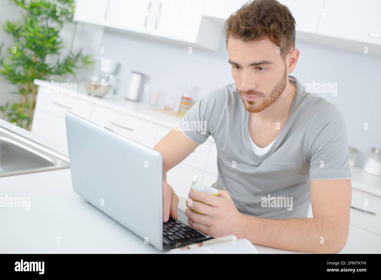 a man is using the laptop Stock Photo
