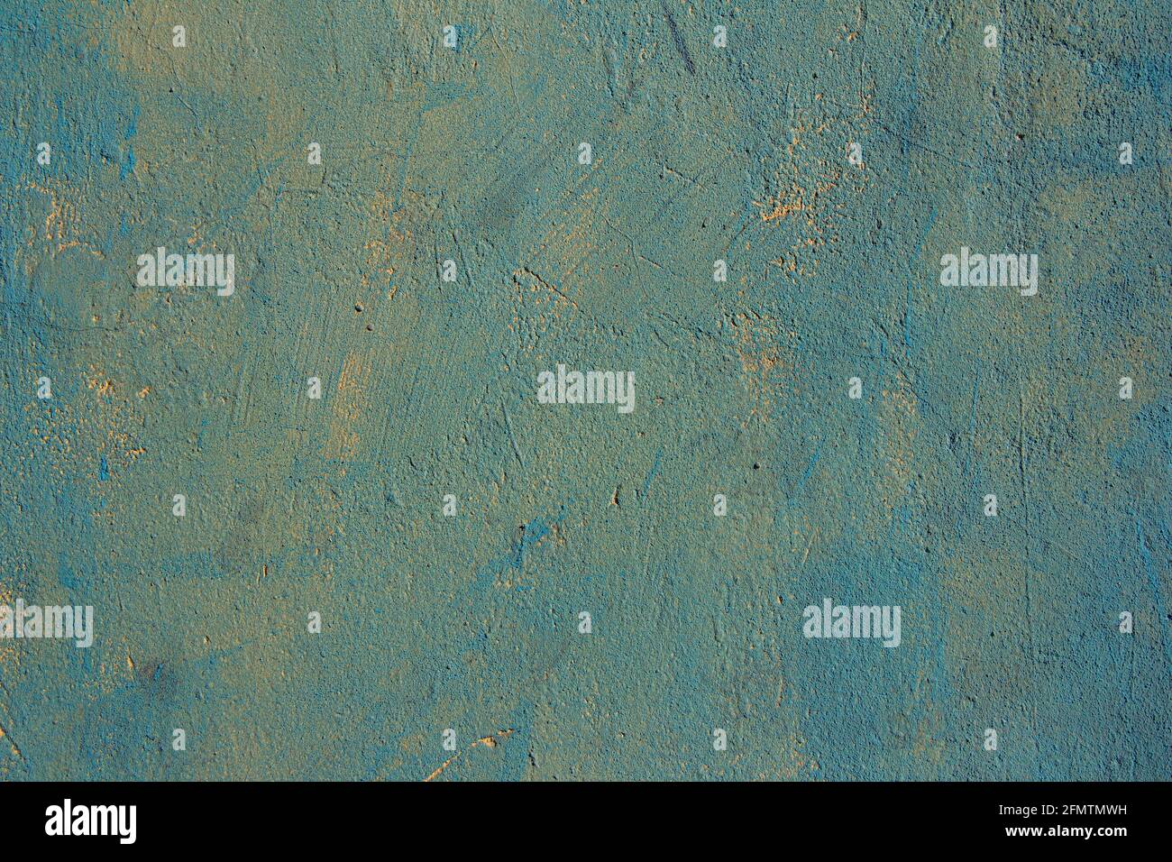 Blue painted over yellow background wall, textured surface Stock Photo