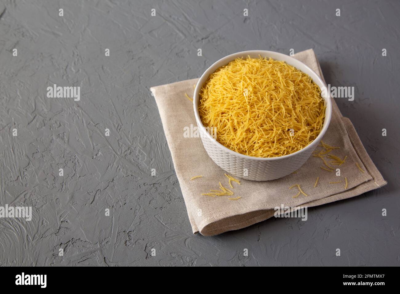 Raw Dry Filini Vermicelles Ready to Cook. Copy space Stock Photo - Alamy