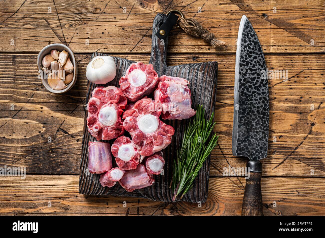 Raw beef Oxtail cut Meat on wooden cutting board with knife. wooden  background. Top view Stock Photo - Alamy