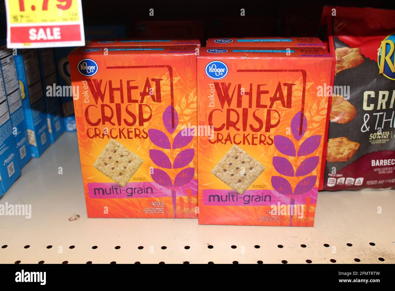 Kroger Wheat Crisp Crackers shot closeup in a colorful box on a metal
