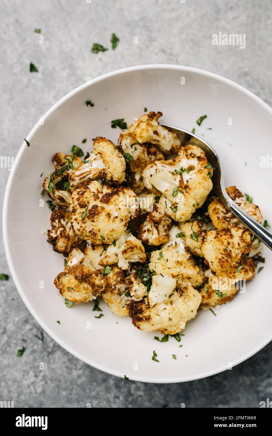 Overhead photo of golden fried cauliflower with parsely Stock Photo