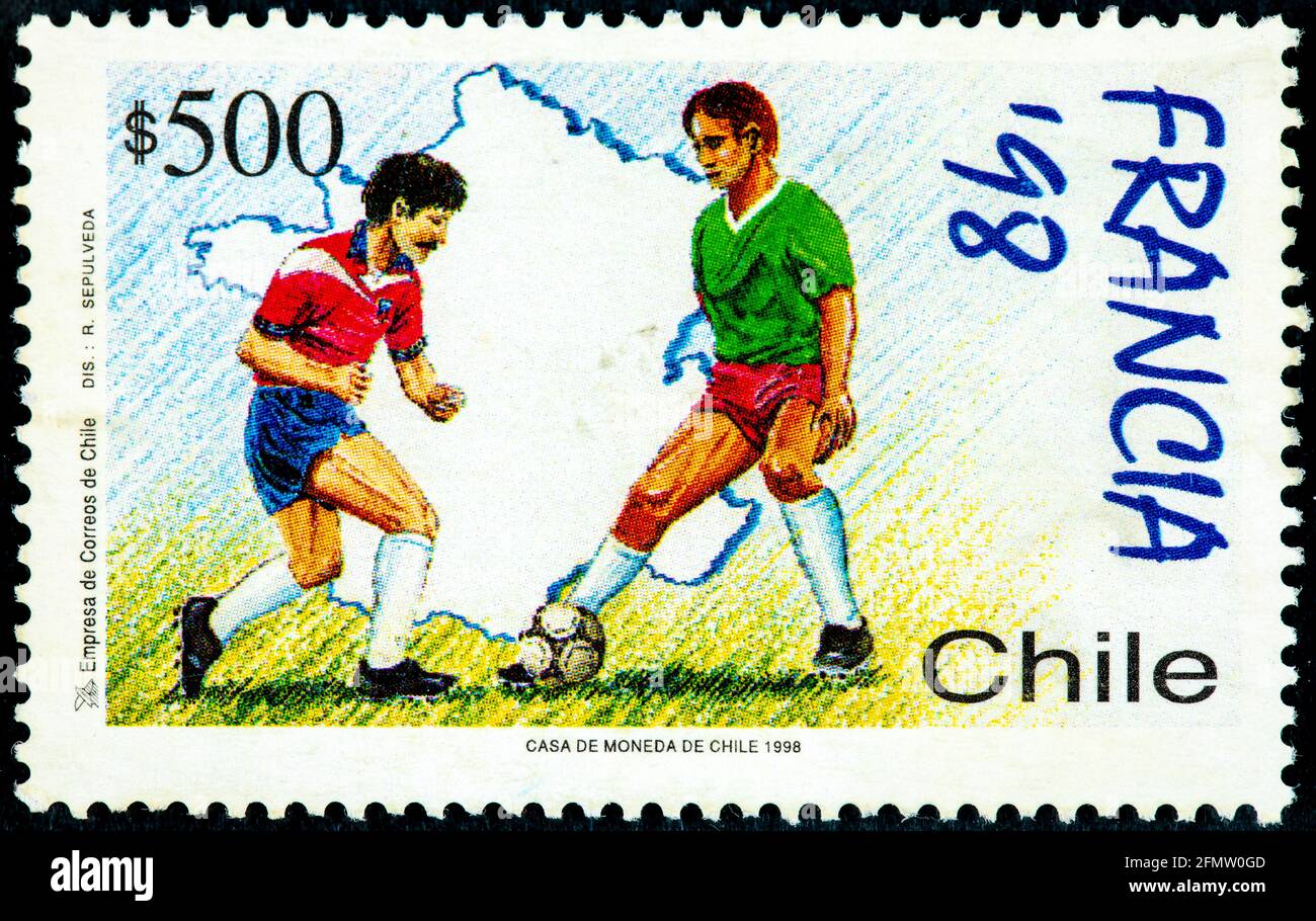 Chile - Circa 1998: Canceled postage stamp printed by Chile, shows two soccer athletes from the series dedicated to the France 98 World Cup, circa 199 Stock Photo