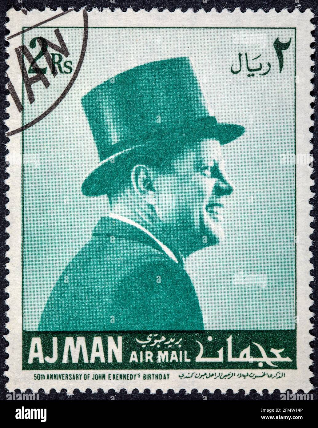 AJMAN - CIRCA 1967: Stamp printed by Ajman shows The American President, John Fitzgerald Kennedy. 1917-1963 Stock Photo