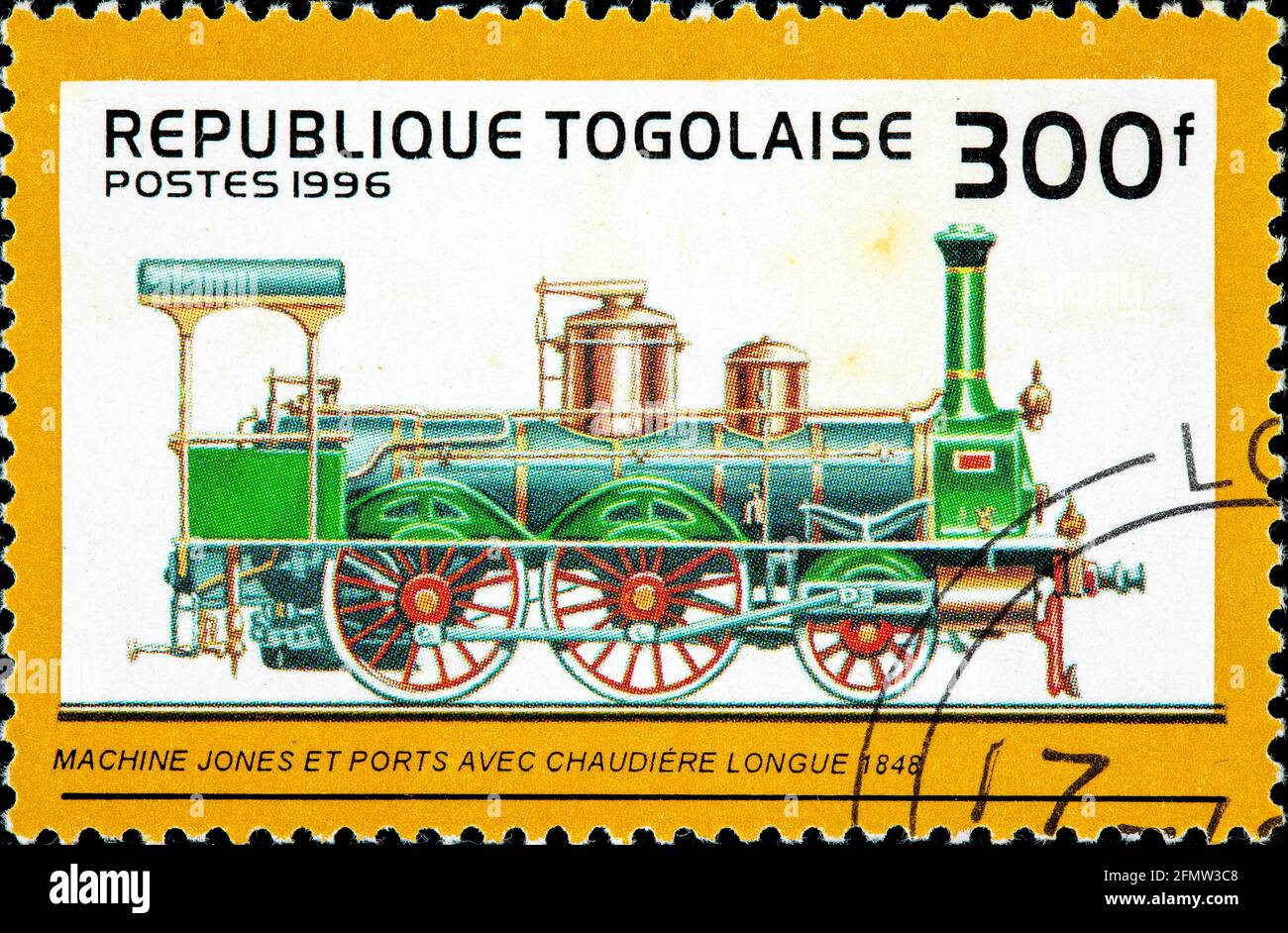 TOGO - CIRCA 1996: A stamp printed in Togo shows an old long boiler type railroad steam engine made by Jones and Potts, circa 1996 Stock Photo