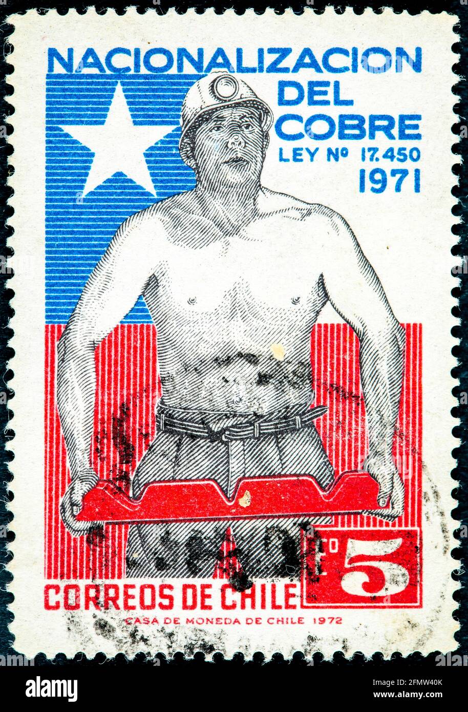 CHILE - CIRCA 1972: Cancelled postage stamp printed by Chile, that shows Miner and Chilean flag. Stock Photo