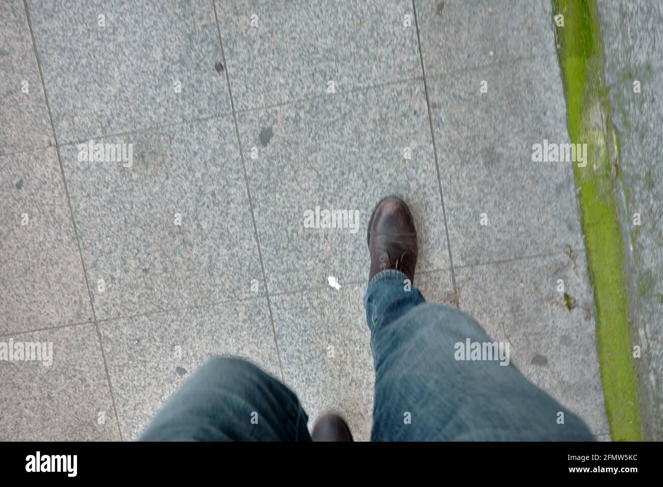Crossed legs wearing blue jeans hi-res stock photography and images - Alamy