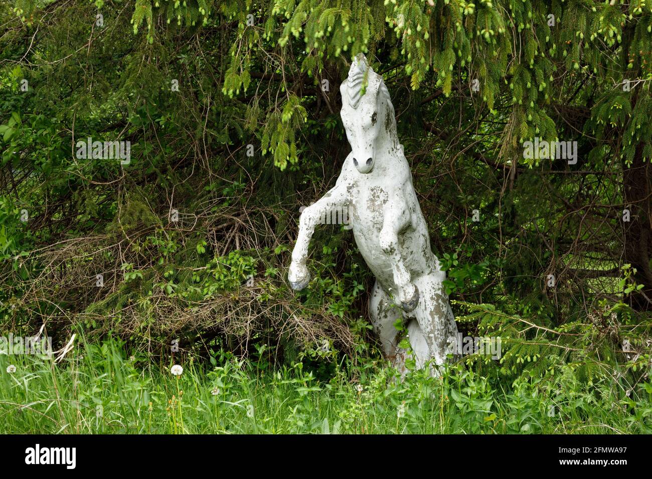 A horse statue in a forest like environment. Stock Photo