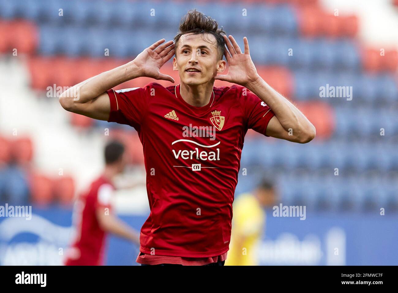 Pamplona, Spain. 11th May, 2021. The referee gives a yellow card to Budimir  during the Spanish La Liga Santander match between CA Osasuna and Cádiz CF  at the Sadar stadium.(Finale Score; CA