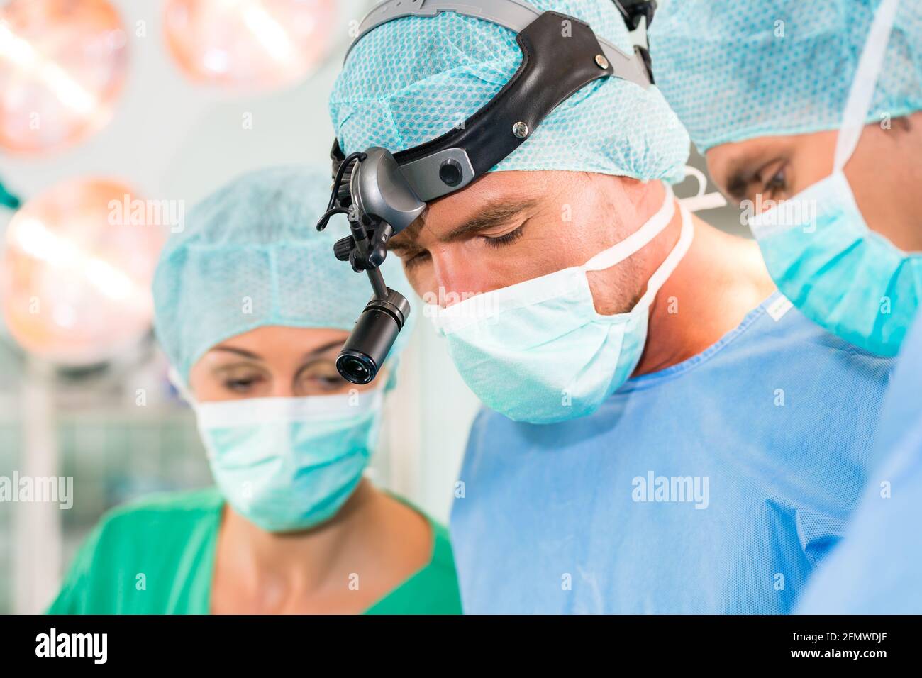 Hospital - surgery team in the operating room or Op of clinic operating ...