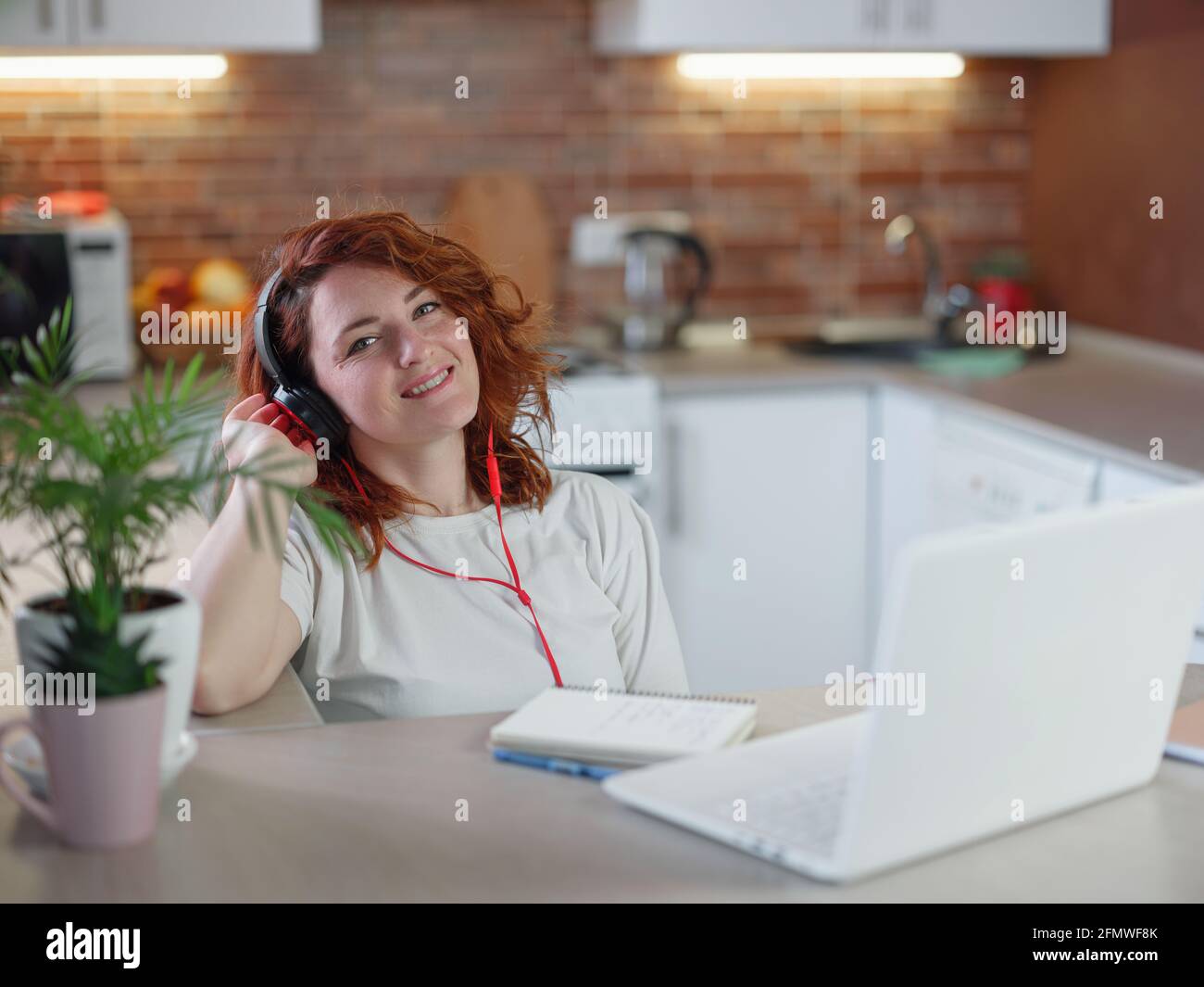 Funky hipster woman listening favorite song or music podcast in headphones  using app at home, happy funny young lady wearing headset enjoying new audi  Stock Photo - Alamy