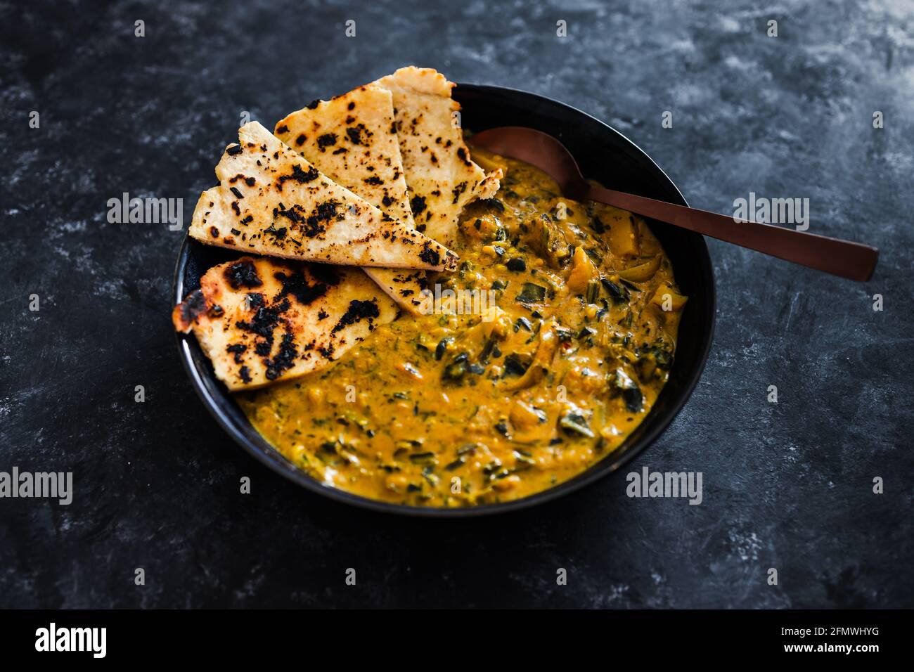 vegan indian yellow curry with homemade dairyfree naan bread, healthy