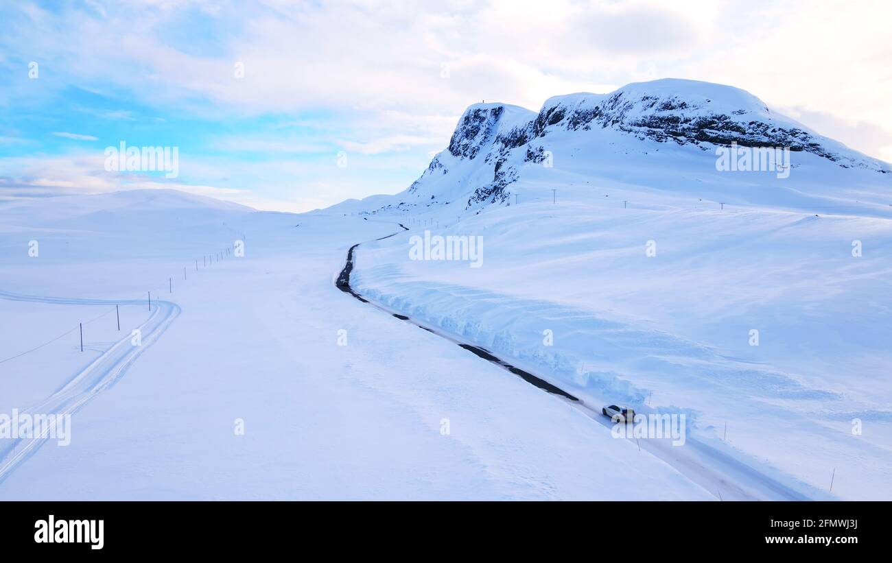 Narrow asphalt road in snowy hi-res stock photography and images - Alamy