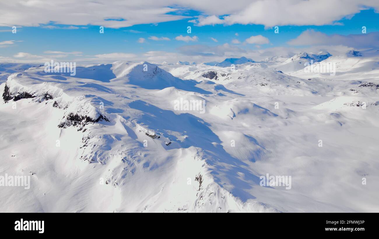 Stunning panoramic view over snow capped arctic mountains. Stock Photo