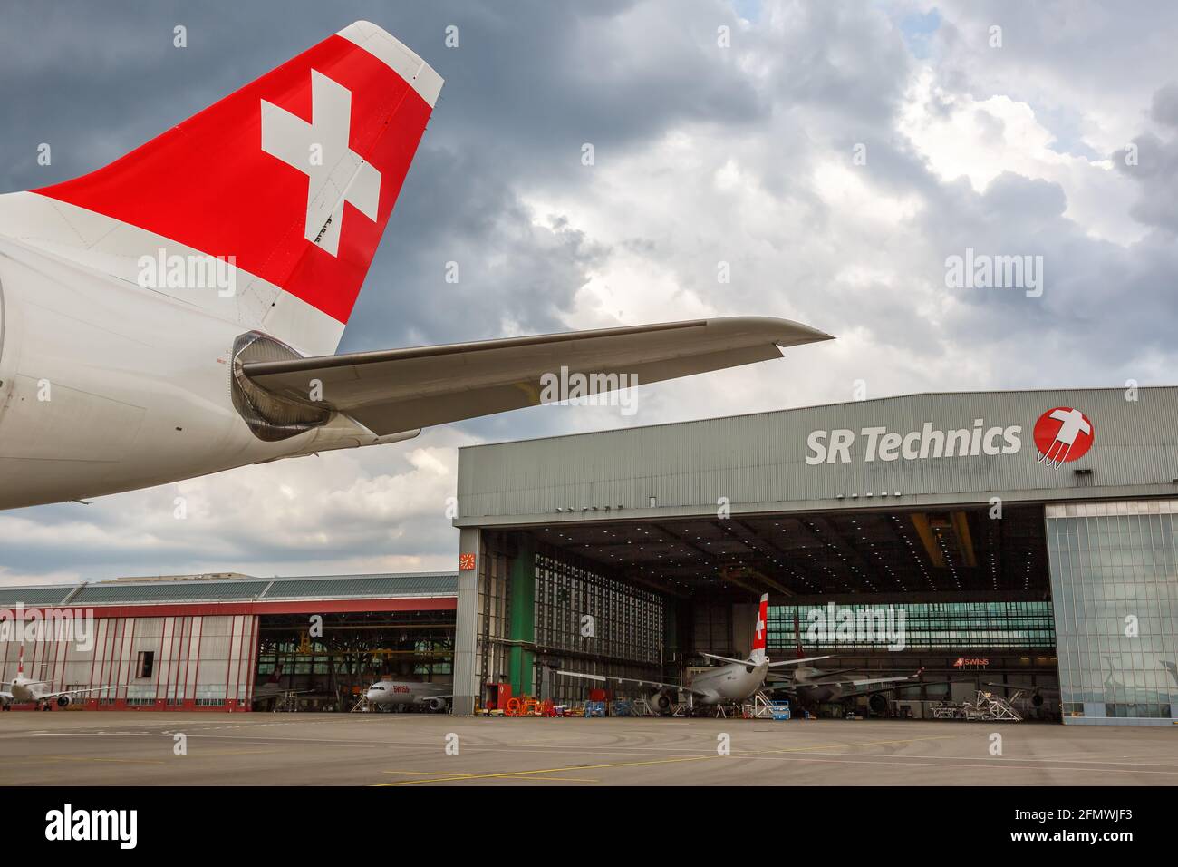 Zurich, Switzerland - July 22, 2020: Swiss Airbus airplane Tail and SR Technics at Zurich Airport (ZRH) in Switzerland. Stock Photo