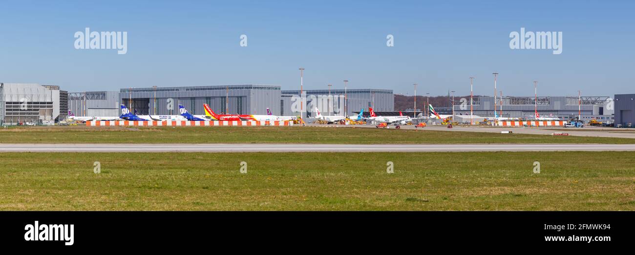 Hamburg, Germany - April 20, 2021: Airplanes at Airbus Hamburg Finkenwerder factory in Germany. Stock Photo