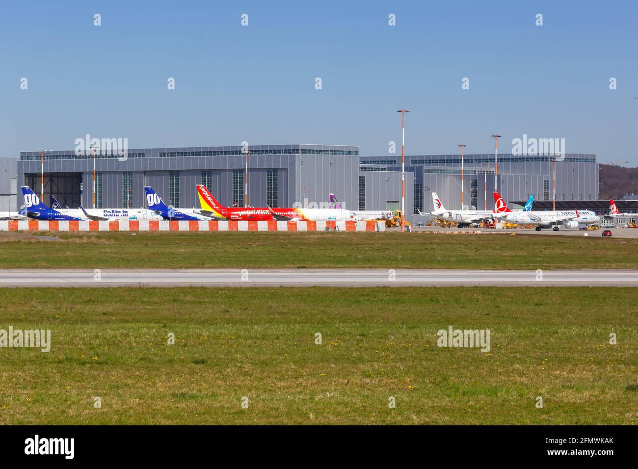 Hamburg, Germany - April 20, 2021: Airplanes at Airbus Hamburg Finkenwerder factory in Germany. Stock Photo