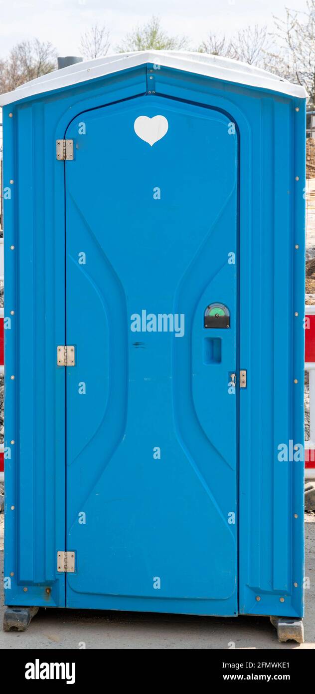 blue plastic toilet house on a construction site Stock Photo