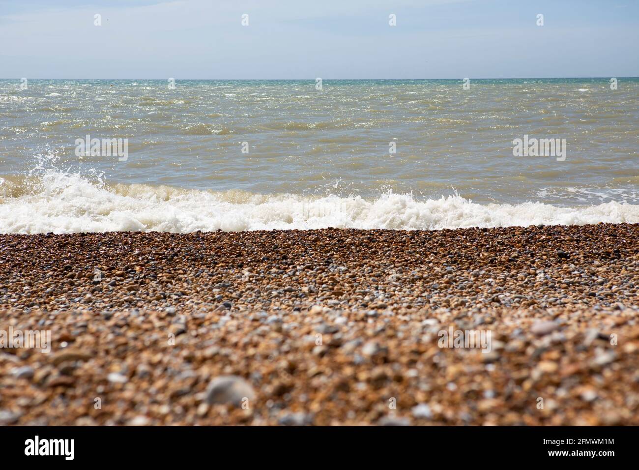 Waves breaking on the shore Stock Photo