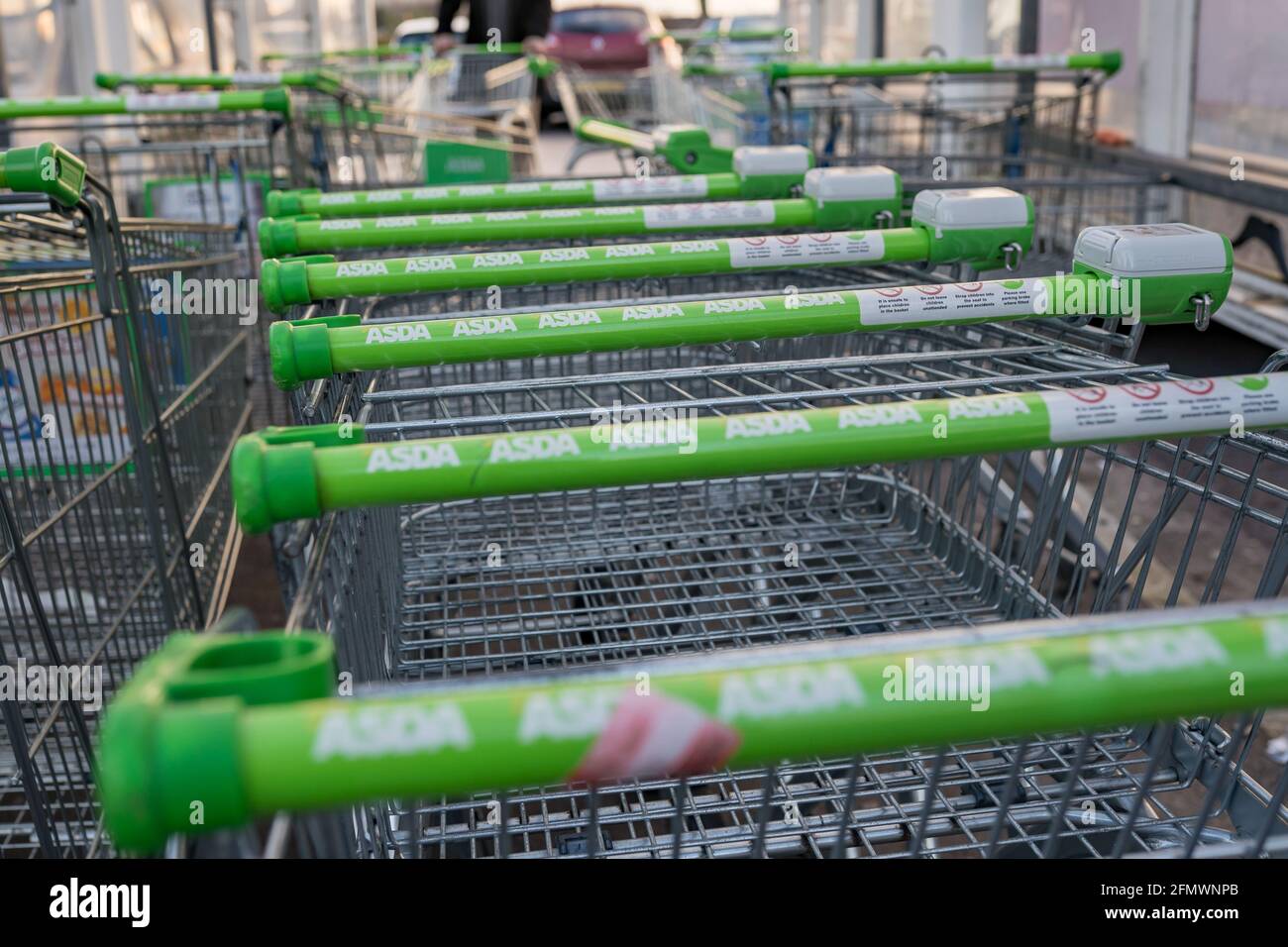 Asda green shopping trolleys row outdoor, UK Stock Photo Alamy