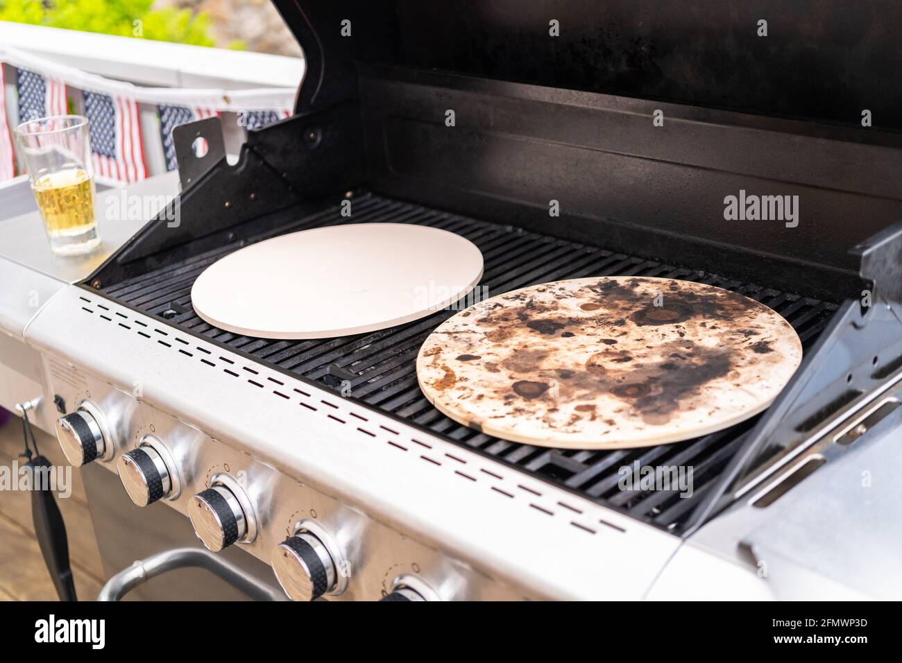 Preheating pizza stones on an outdoor gas grill Stock Photo Alamy
