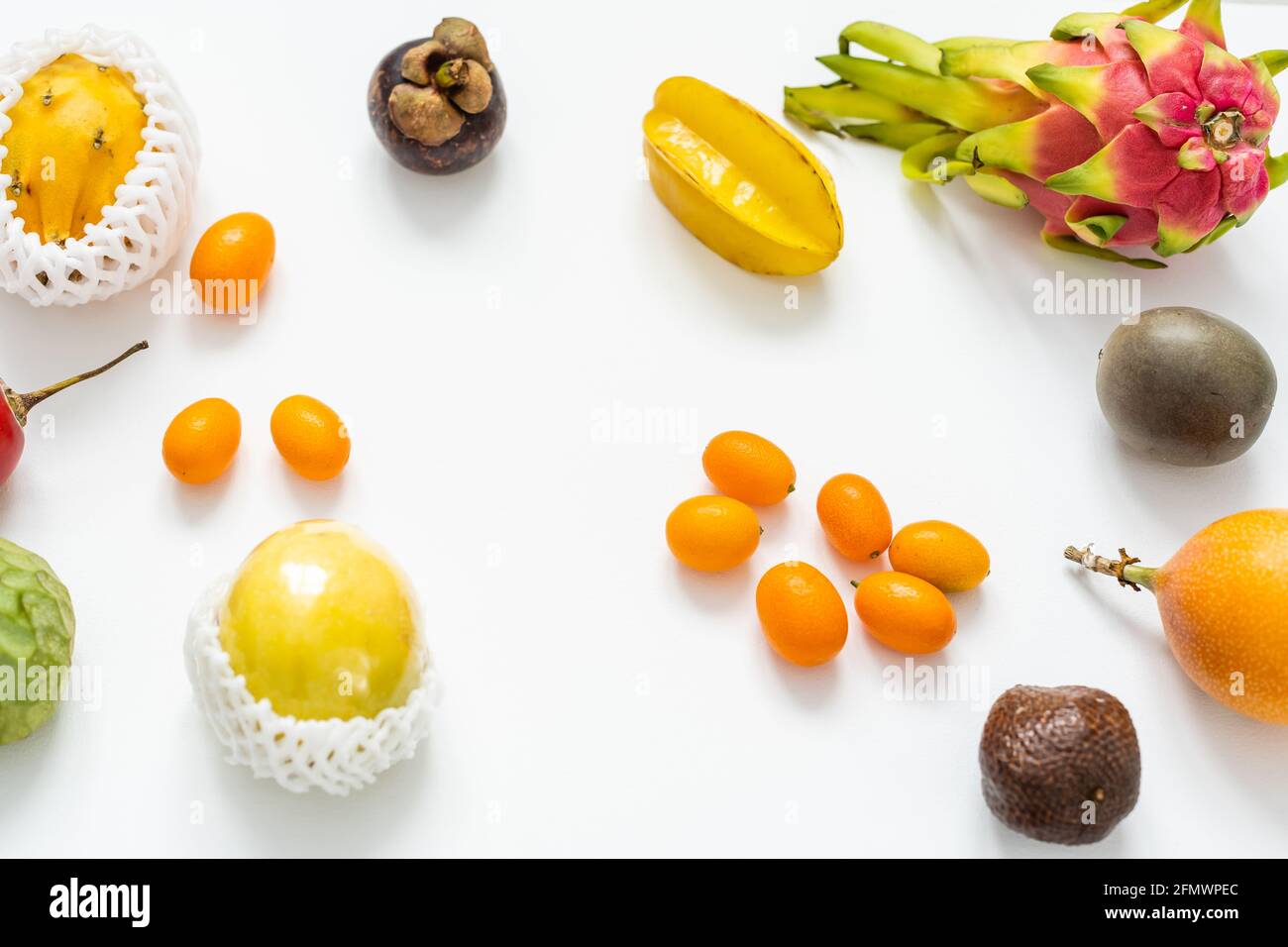 Still life of fruit in a box isolated on white Stock Photo - Alamy