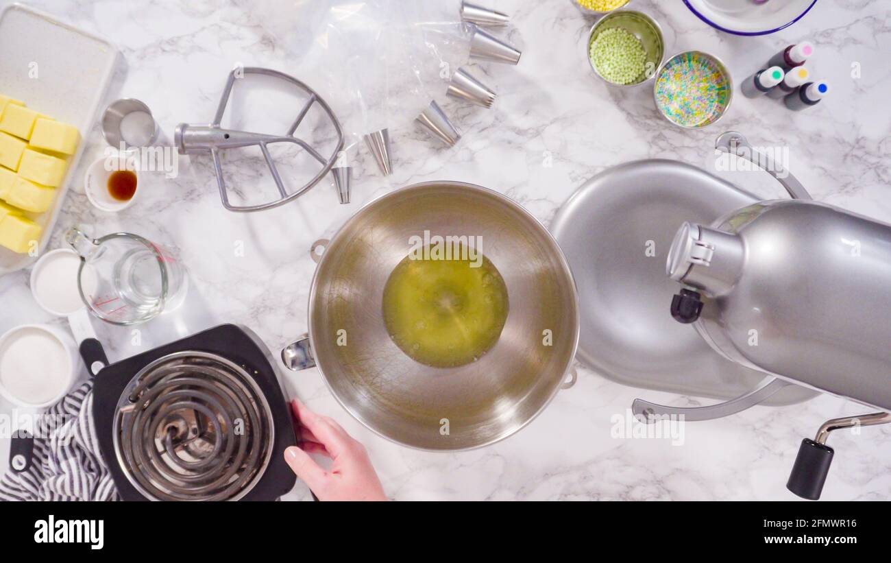 Preparing Italian buttercream frosting in standing kitchen mixer Stock