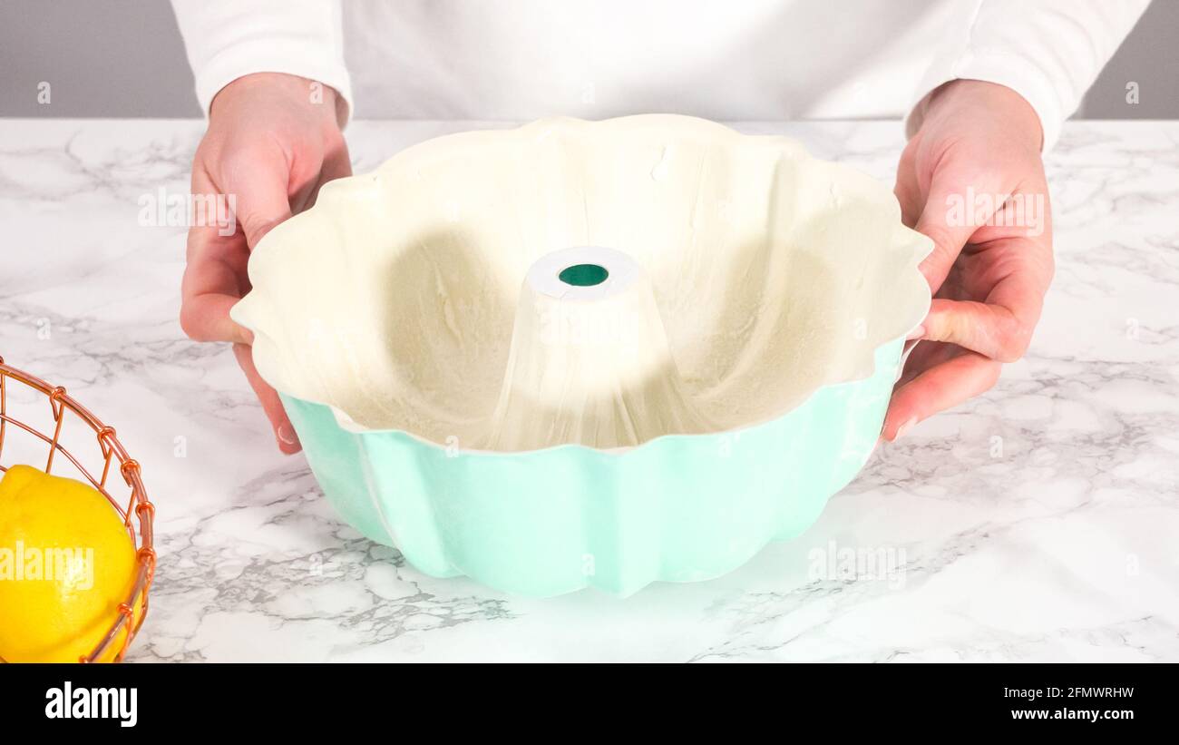 Step by step. Greasing bundt cake pan with vegetable shortening and