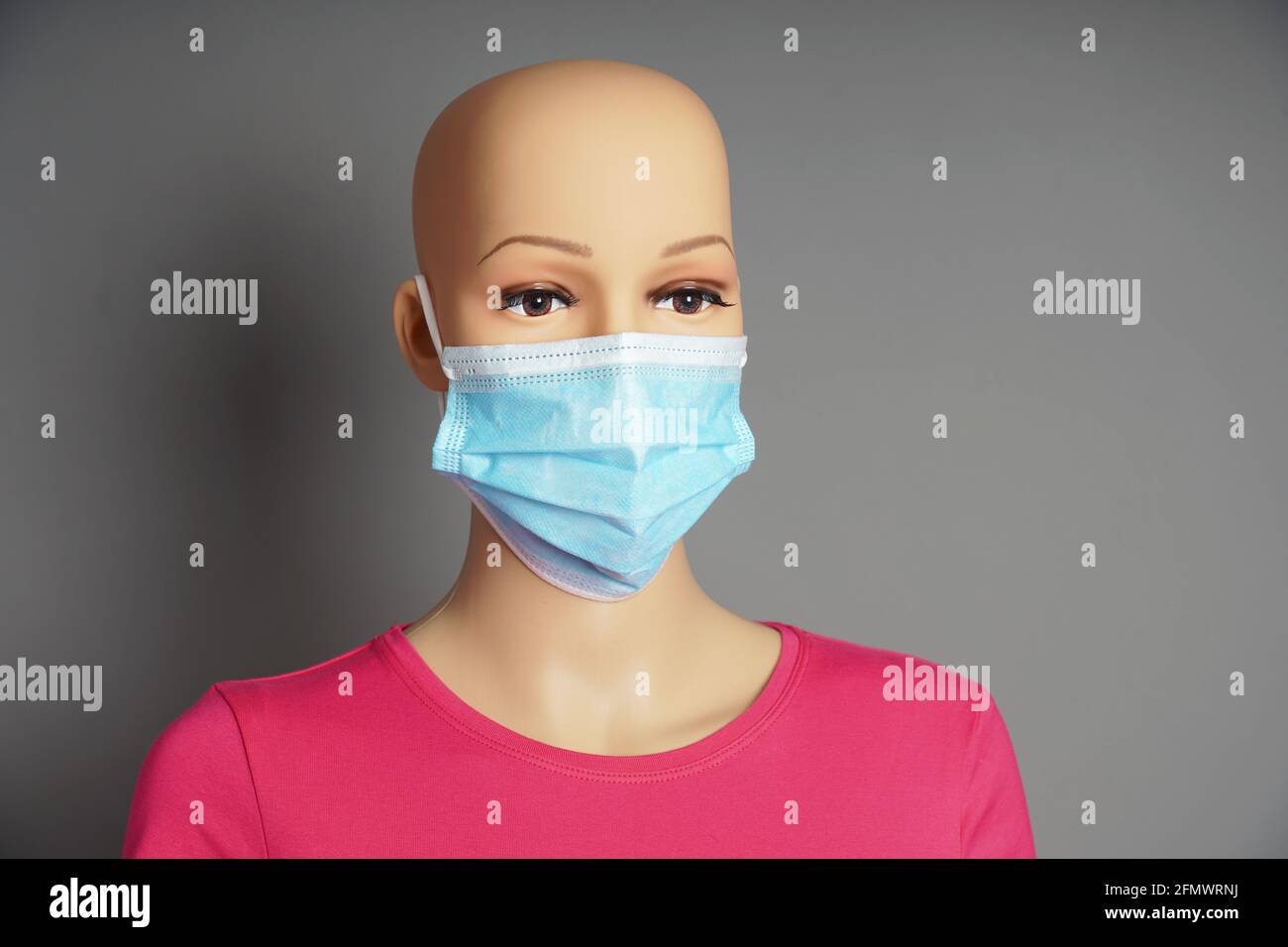 shop window mannequin or display dummy head wearing medical face mask