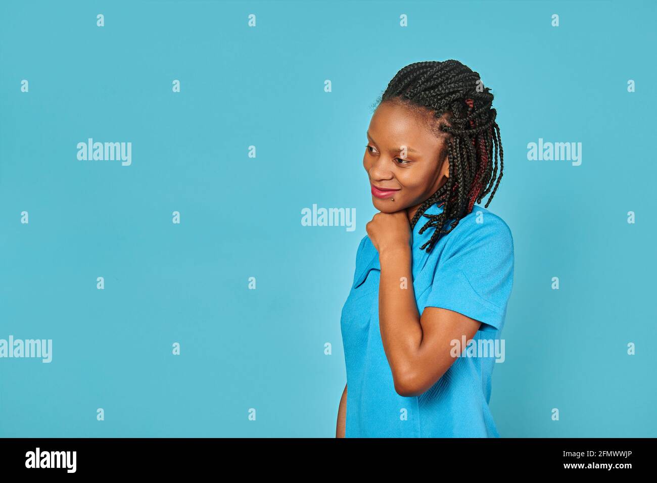 cute african american girl in dress. blue background Stock Photo - Alamy