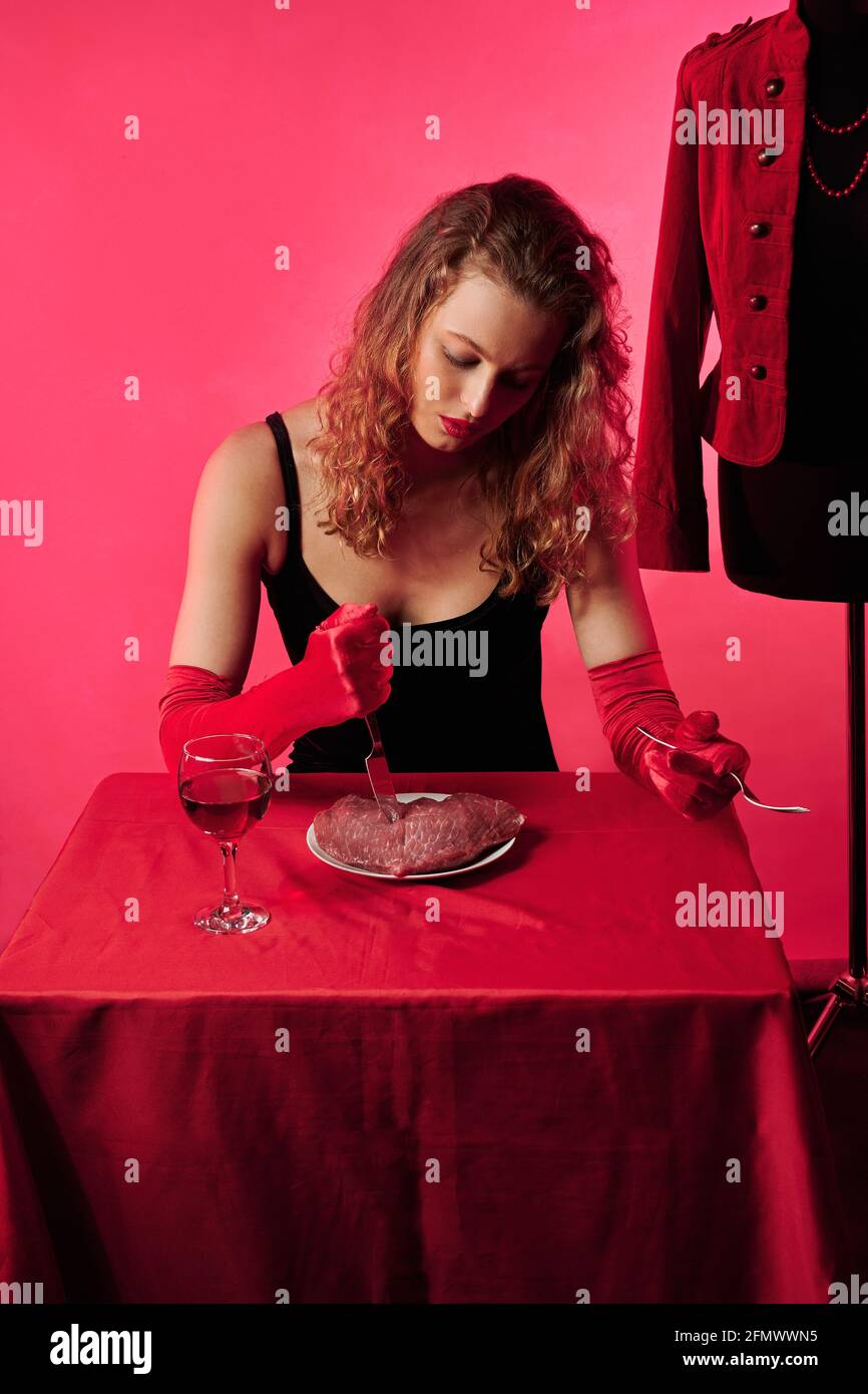 glamorous girl at the table to eat meat. fashion concept Stock Photo - Alamy