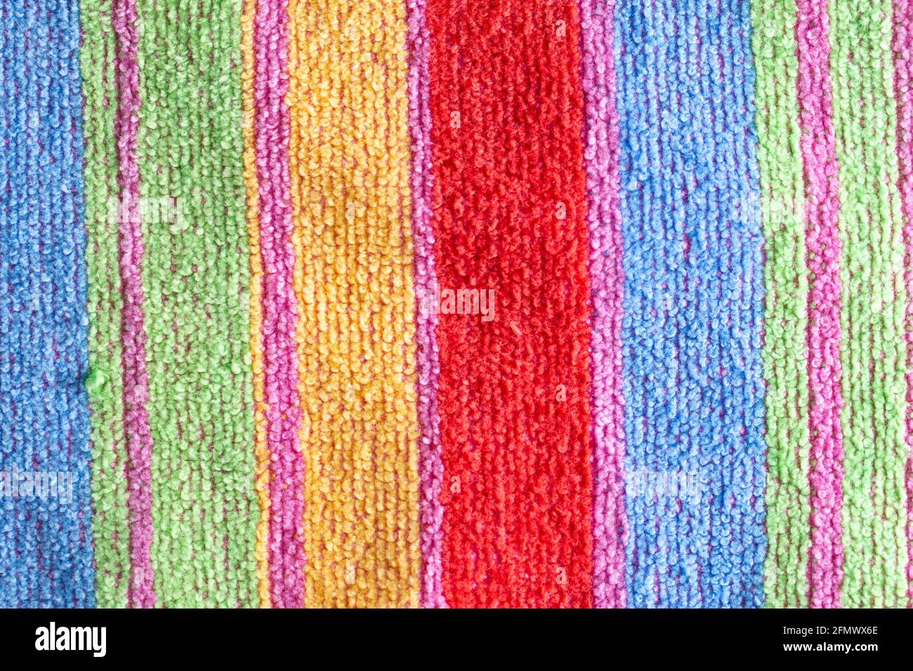 Multi-colored terry towel with stripes, background, macro. Stock Photo