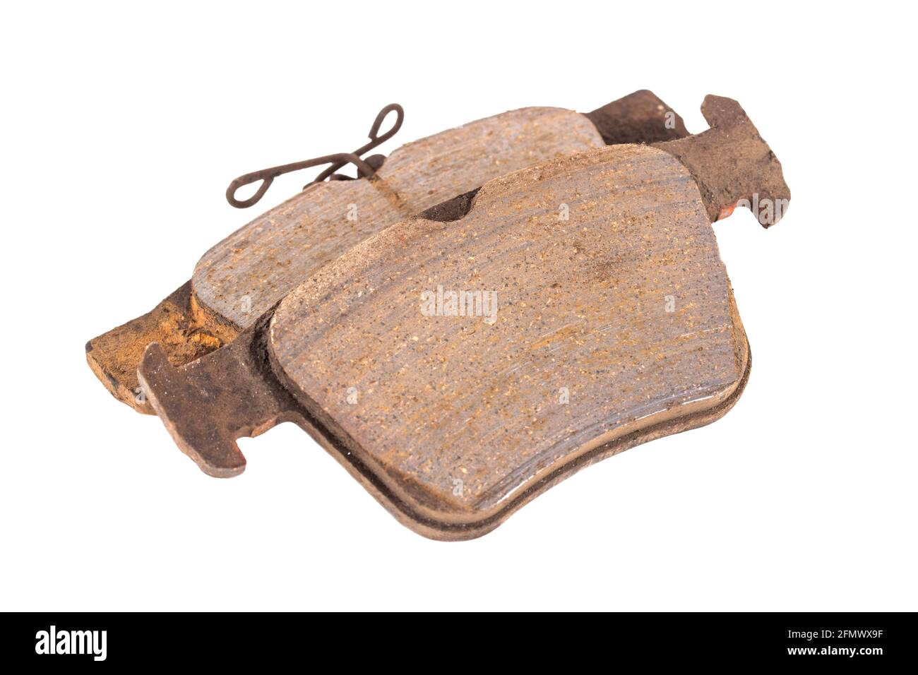 Old worn out brake pads from a car on a white background, isolate