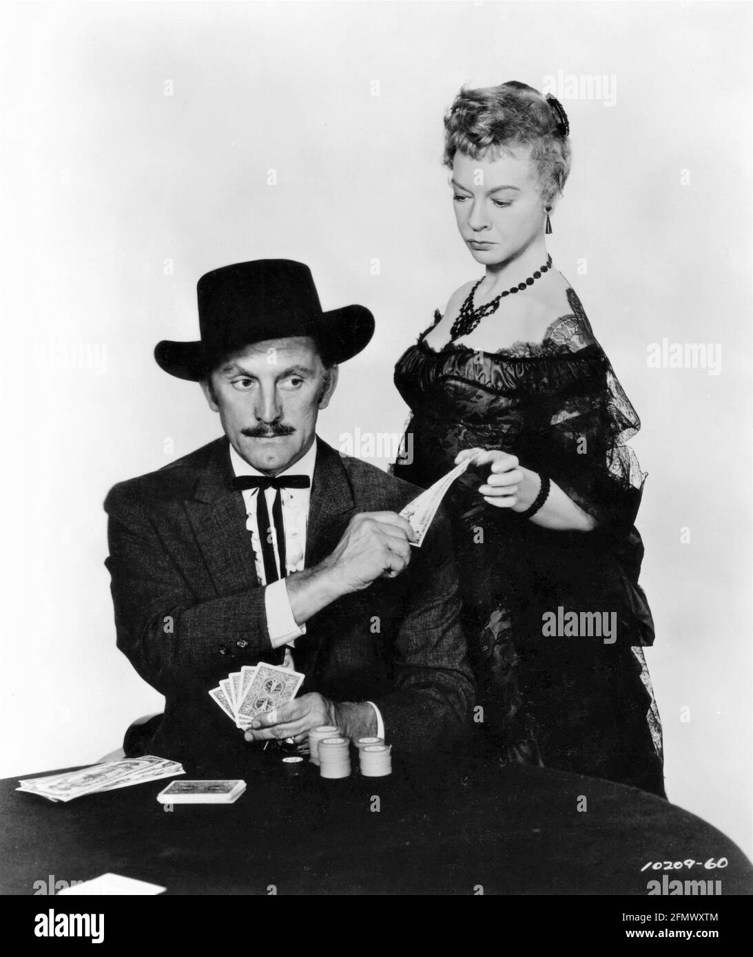 KIRK DOUGLAS as Doc Holliday and JO VAN FLEET in GUNFIGHT AT THE O.K. CORRAL 1957 director JOHN STURGES screenplay Leon Uris music Dimitri Tiomkin producer Hal B. Wallis  Wallis-Hazen / Paramount Pictures Stock Photo