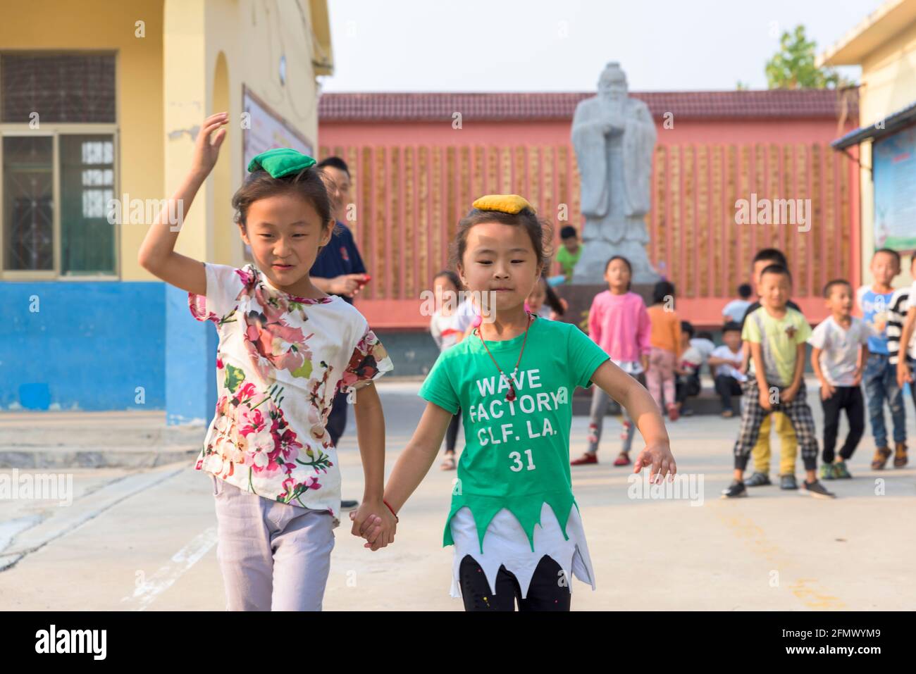 Primary students taking part in a relay race in a rural school in Qufu, Shandong, China. Stock Photo