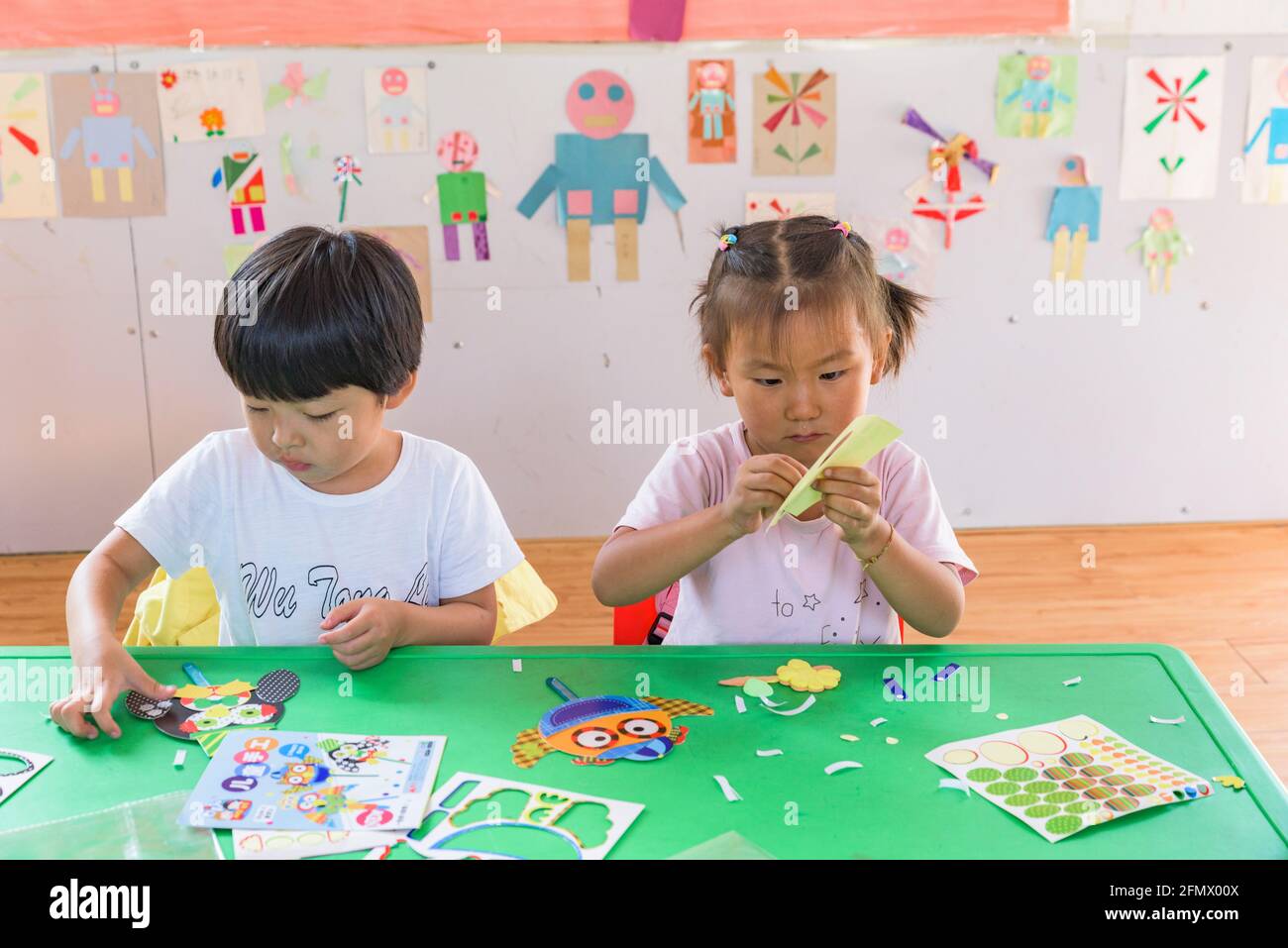 Students in a primary school in rural China working on an art and craft project. Stock Photo