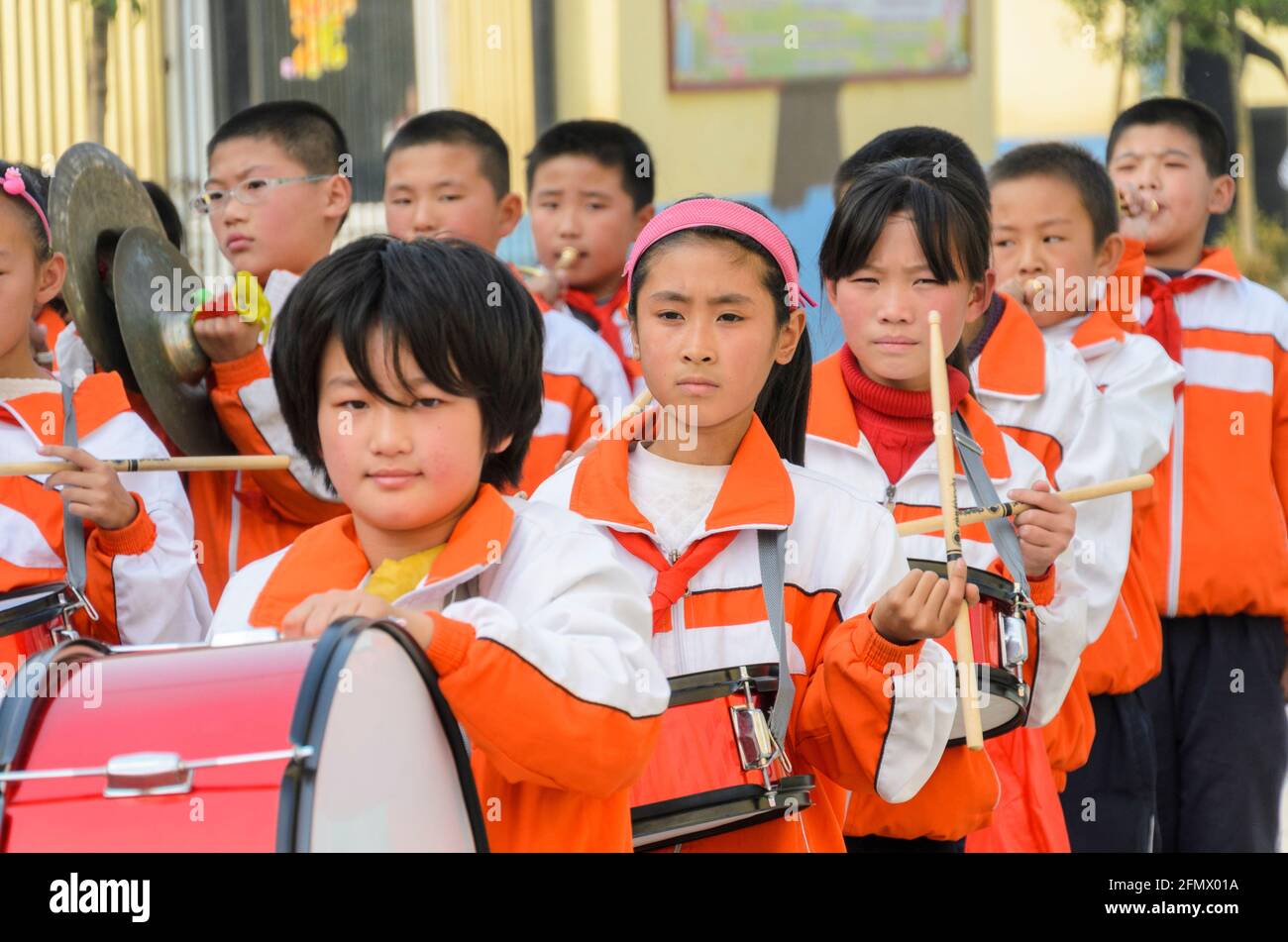 A primary school marching band guests to the school in rural