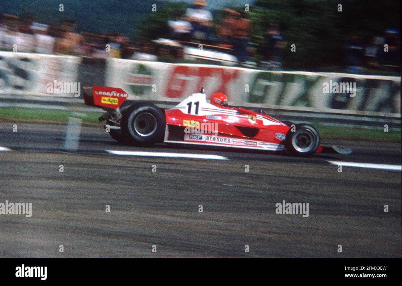 Niki Lauda at speed in the Ferrari 312 T2 during practice for the 1977  British Grand Prix, Silverstone Stock Photo - Alamy