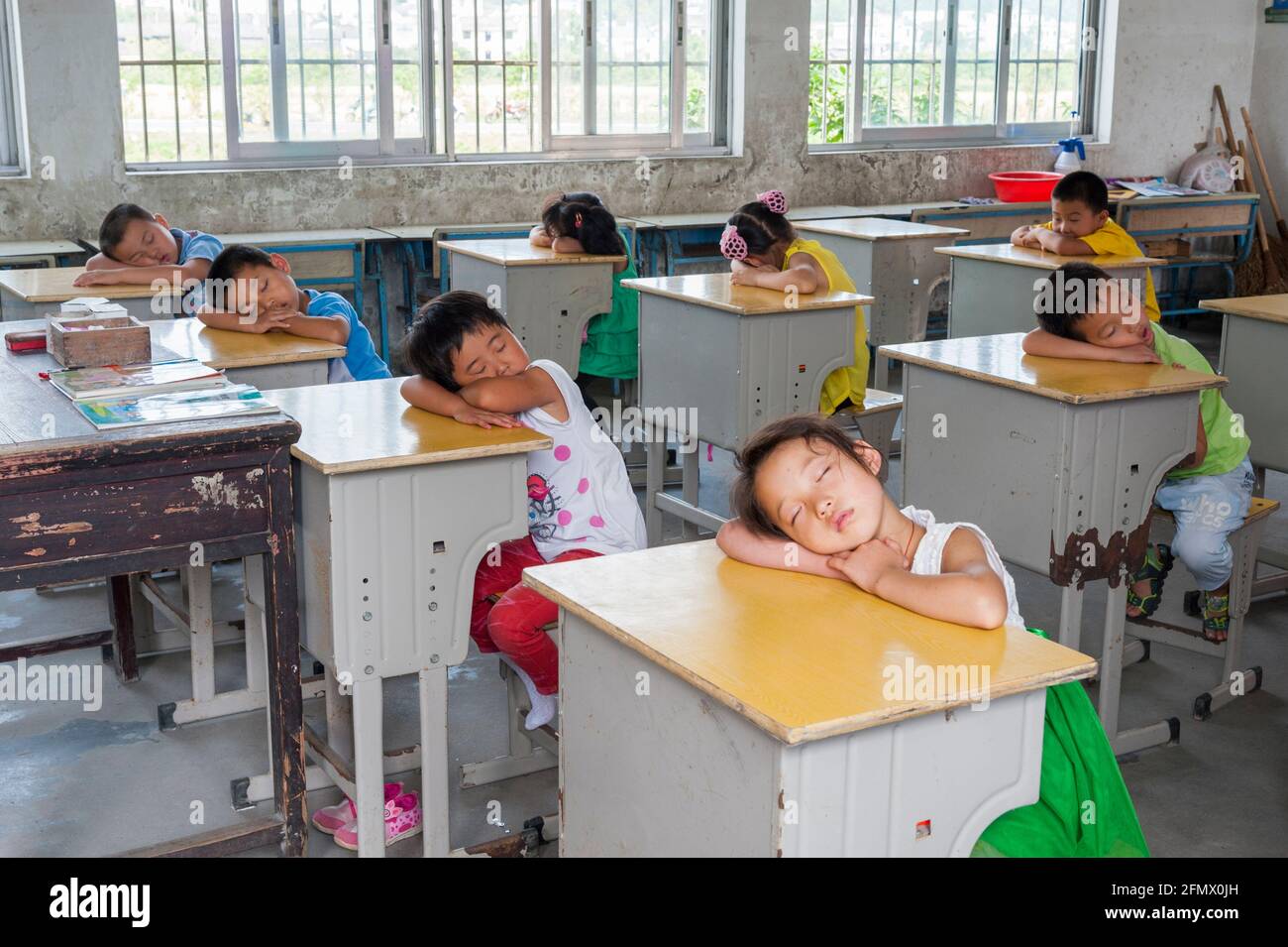 Kindergarten and primary students take a nap after lunch in China. Stock Photo