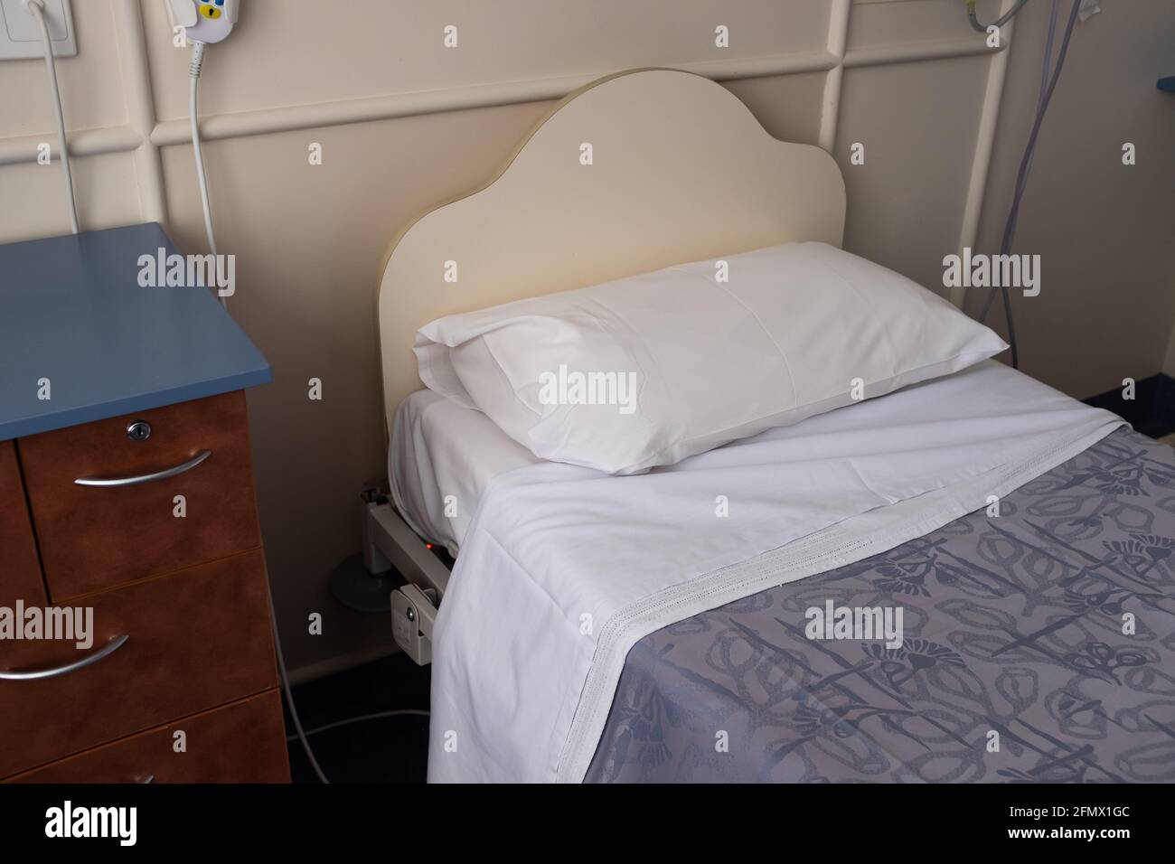 A hospital bed in a generic hospital room Stock Photo