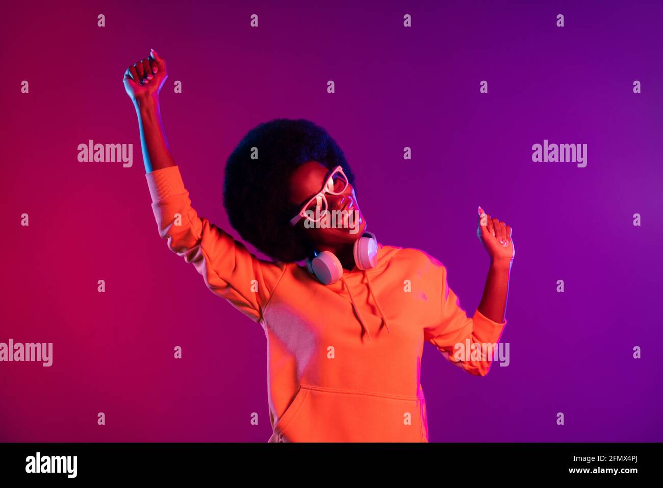 Photo of crazy funny lady dance sing wear sweatshirt earphones glasses ...