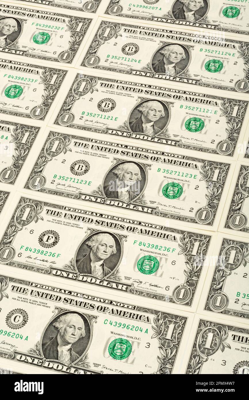 Obverse side US $1 / one dollar bills with George Washington portrait arranged in regular formation. For US trillion $ debt mountain, US bank crisis. Stock Photo