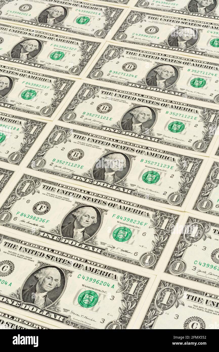 Obverse side US $1 / one dollar bills with George Washington portrait arranged in regular formation. For US trillion $ debt mountain, US bank crisis. Stock Photo