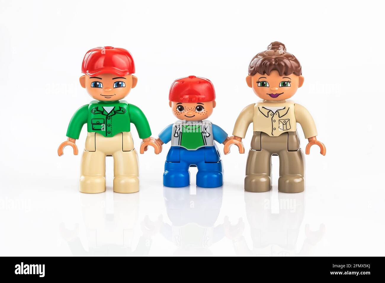 Toy family of three, plastic toys, preschool education theme, isolated