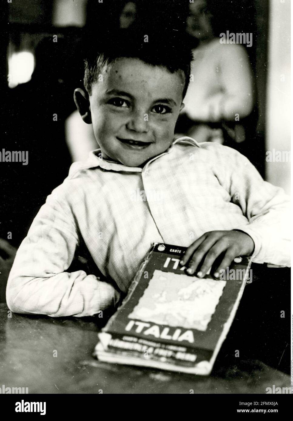 people, children, portrait - boys, boy with roadmap, Italy, 1950s, ADDITIONAL-RIGHTS-CLEARANCE-INFO-NOT-AVAILABLE Stock Photo
