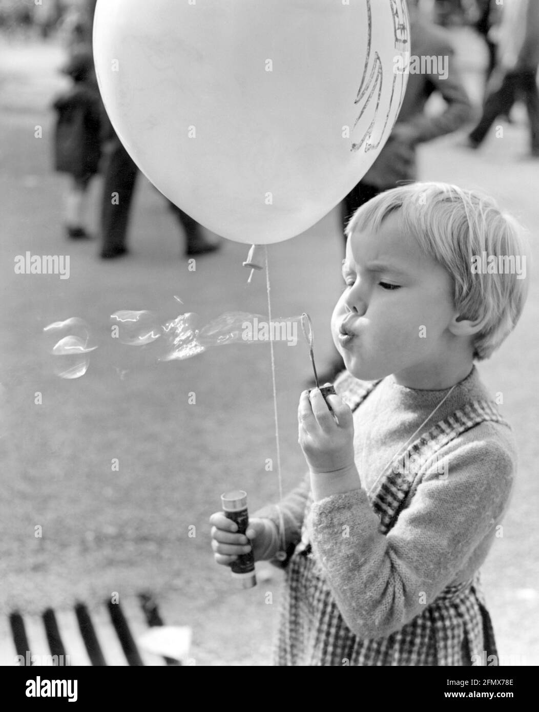 people, children, games, infant with soap bubble and balloon, 1950s, ADDITIONAL-RIGHTS-CLEARANCE-INFO-NOT-AVAILABLE Stock Photo