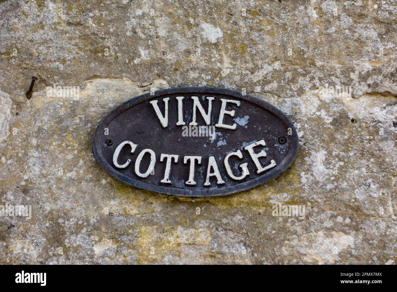 Vine cottage plaque, Gloucestershire, UK Stock Photo