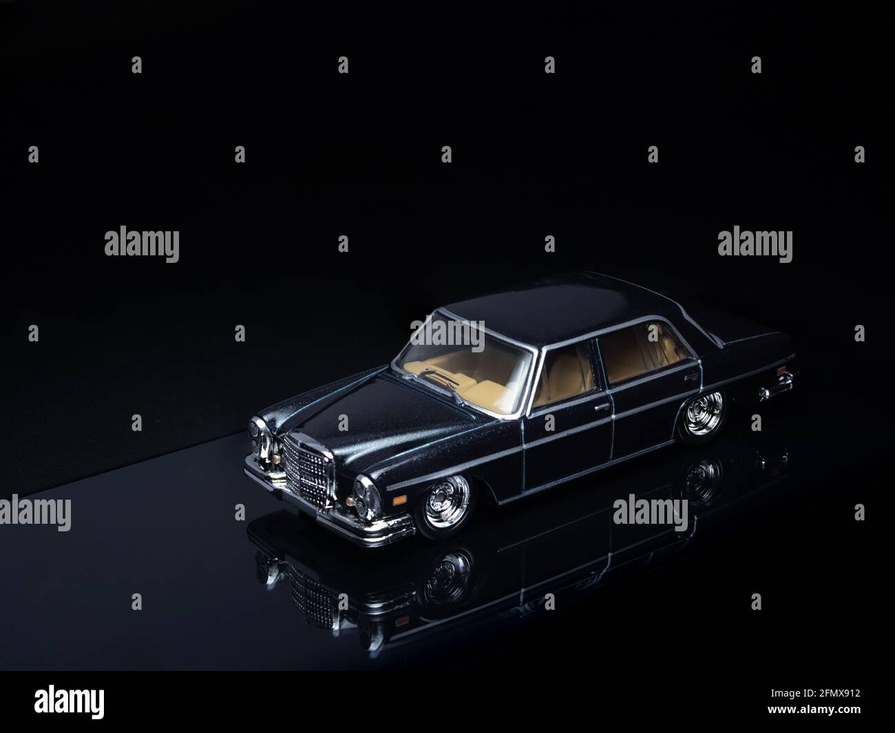 1/64 scale Hot Wheels black 1972 Mercedes-Benz 280 SEL 4.5 dieacst toy car  on a dark black background Stock Photo - Alamy