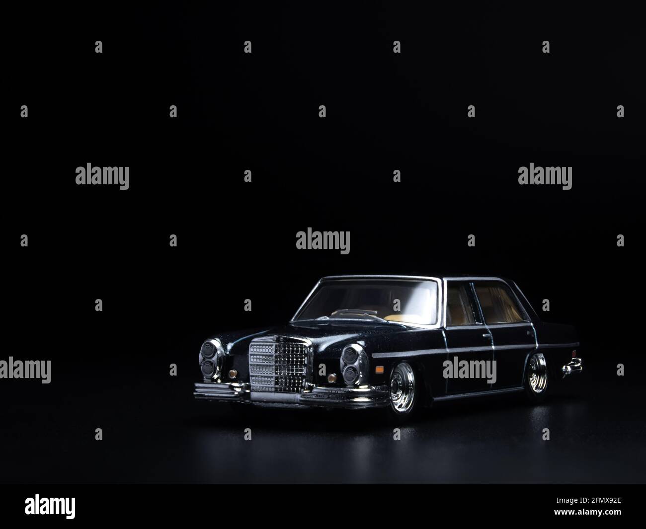 1/64 scale Hot Wheels black 1972 Mercedes-Benz 280 SEL 4.5 dieacst toy car  on a dark black background Stock Photo - Alamy